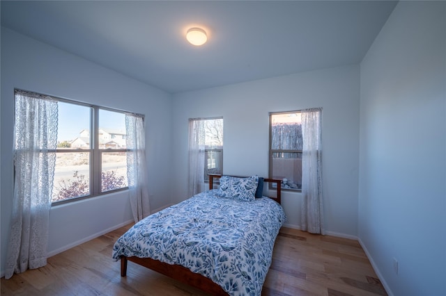 bedroom with light wood-type flooring