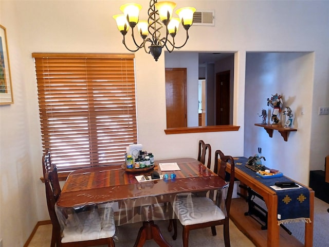 dining area with a notable chandelier