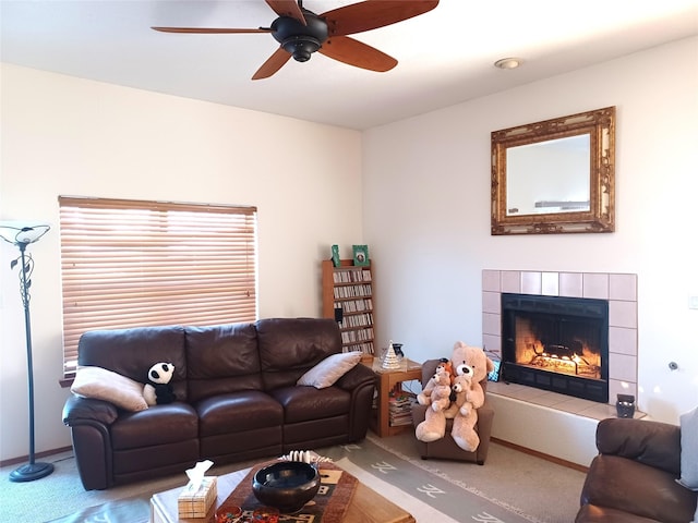 living room featuring ceiling fan, carpet flooring, and a fireplace