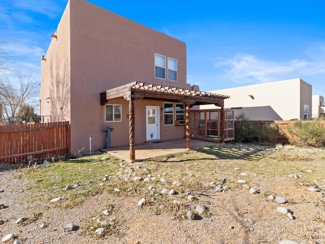 3110 Floras Del Sol, Santa Fe, NM 87507 - rear view of house with a patio area