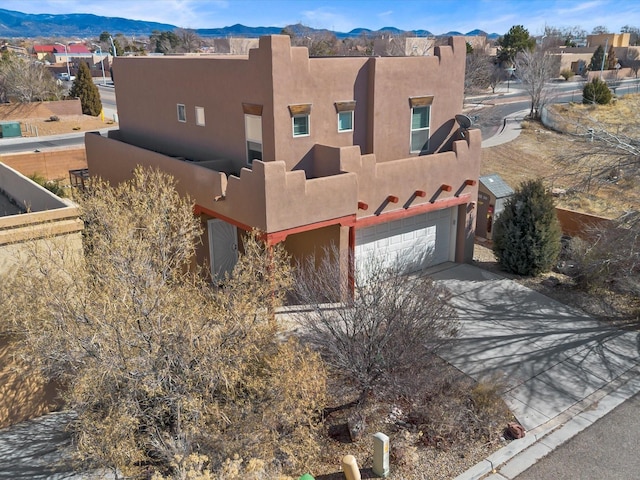 3110 Floras Del Sol, Santa Fe, NM 87507 - southwest-style home featuring a mountain view and a garage