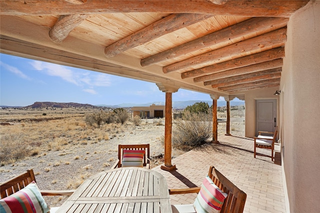 view of patio / terrace featuring a mountain view