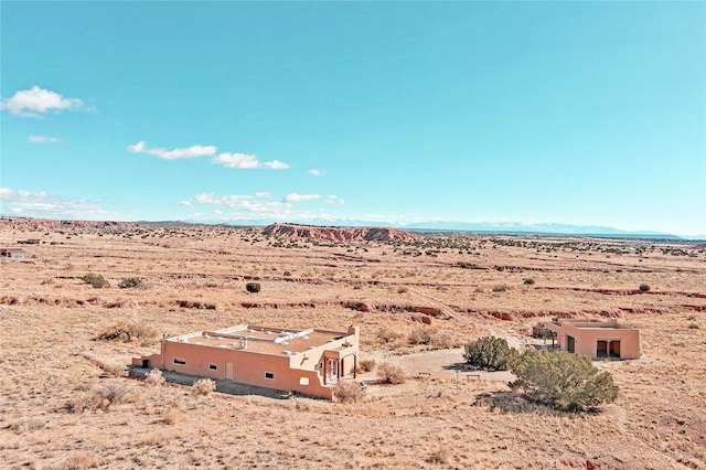 drone / aerial view featuring a mountain view