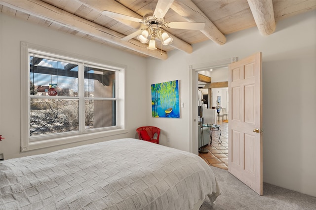 bedroom featuring ceiling fan, carpet, wood ceiling, and beam ceiling