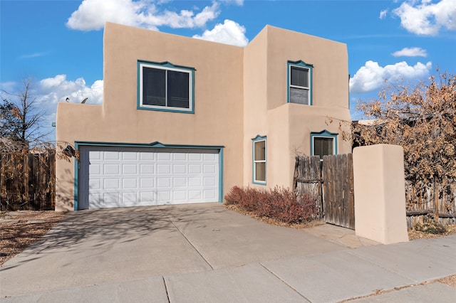 southwest-style home with a garage