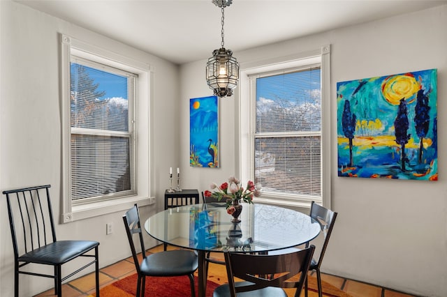 dining space featuring tile patterned floors and a wealth of natural light