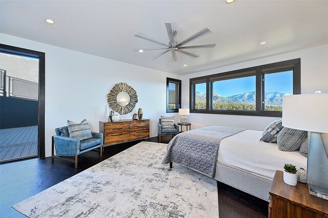 bedroom with dark hardwood / wood-style flooring, access to outside, and ceiling fan