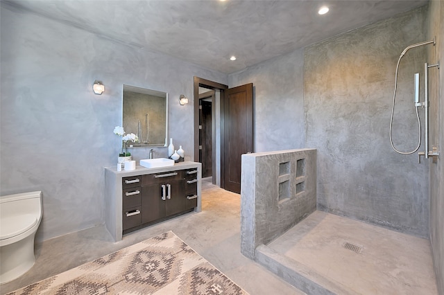 bathroom featuring concrete flooring, vanity, toilet, and walk in shower