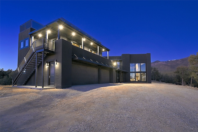 contemporary house with a garage and a mountain view