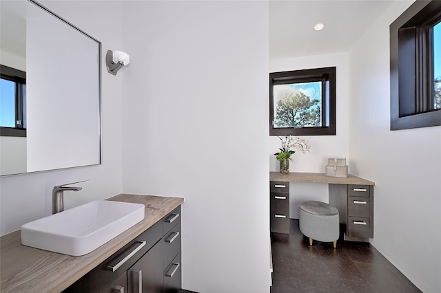 bathroom featuring vanity and concrete floors