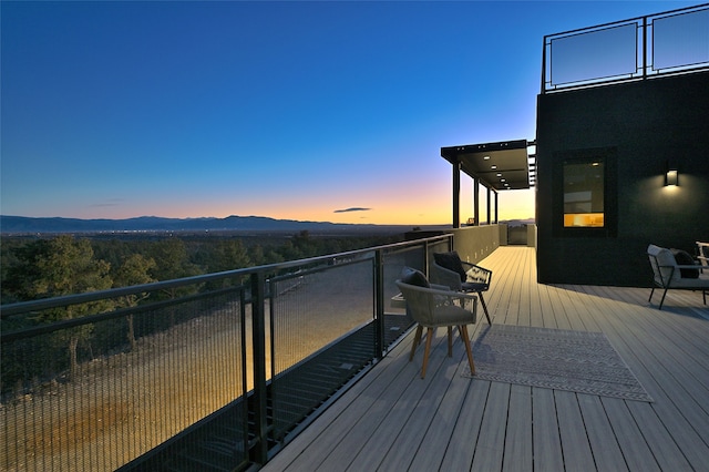 deck at dusk with a mountain view