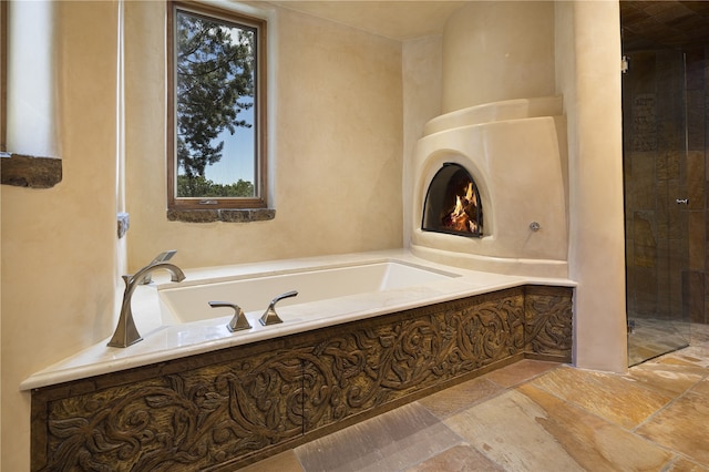 bathroom featuring a tub to relax in