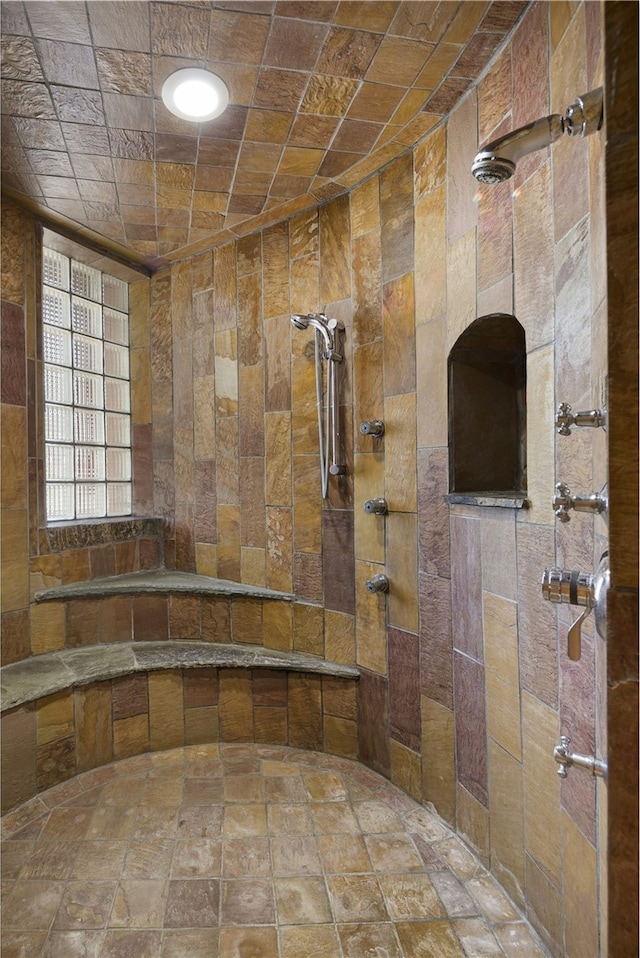 bathroom with tiled shower