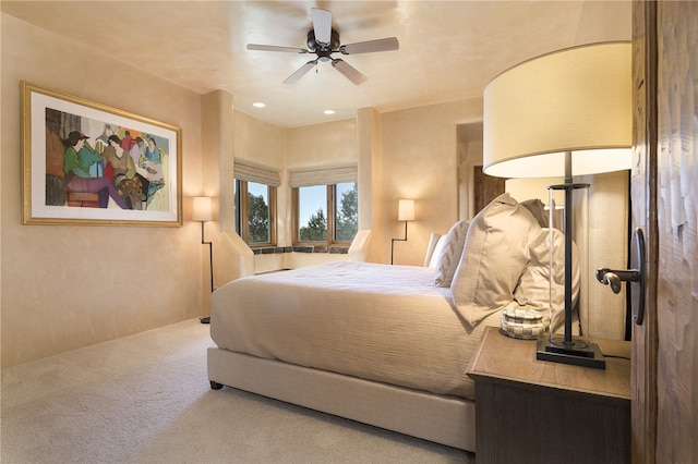 bedroom featuring ceiling fan and carpet floors