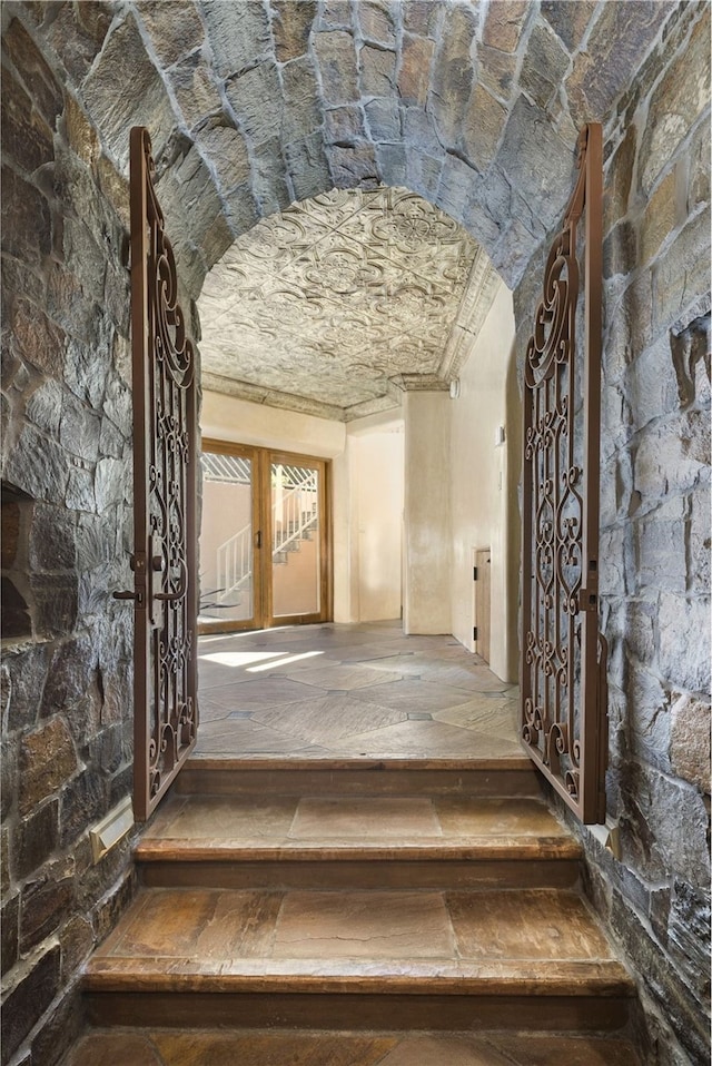 staircase featuring wood-type flooring and french doors