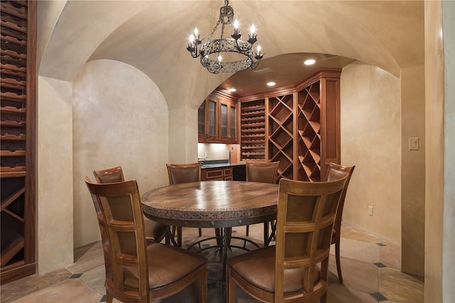 wine room with vaulted ceiling