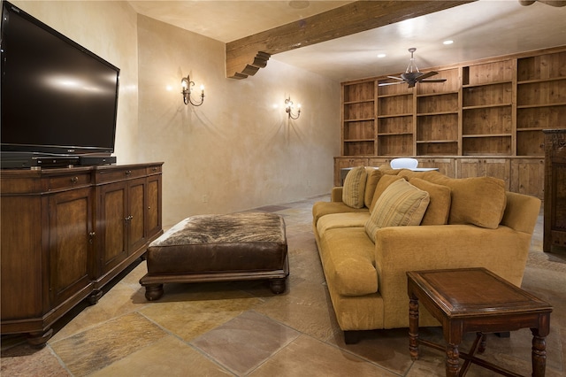 sitting room with ceiling fan, beam ceiling, and built in features