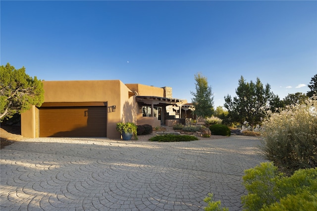 southwest-style home with a garage