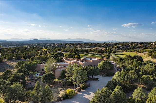 birds eye view of property with a mountain view