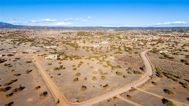 drone / aerial view featuring a mountain view