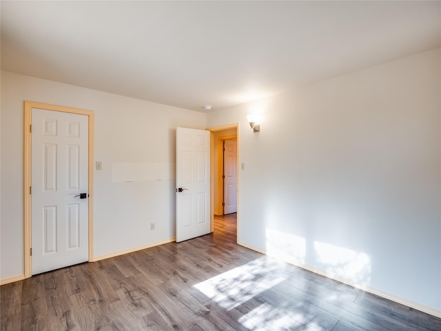 spare room with light hardwood / wood-style floors