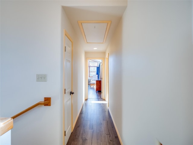 hallway with dark wood-type flooring