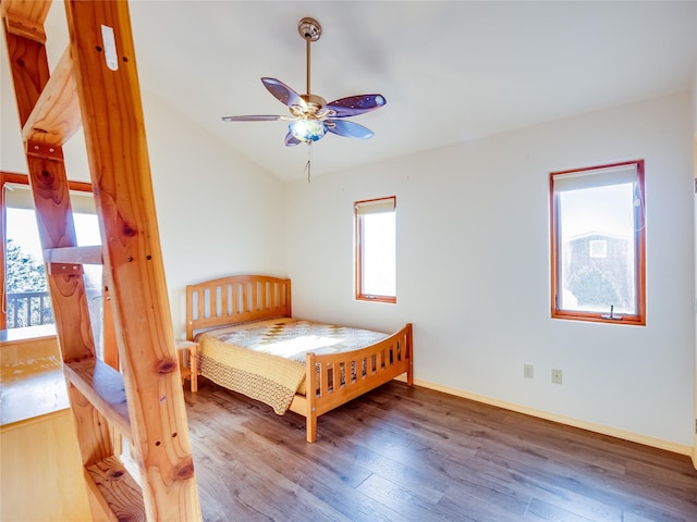 bedroom featuring vaulted ceiling, ceiling fan, and hardwood / wood-style floors