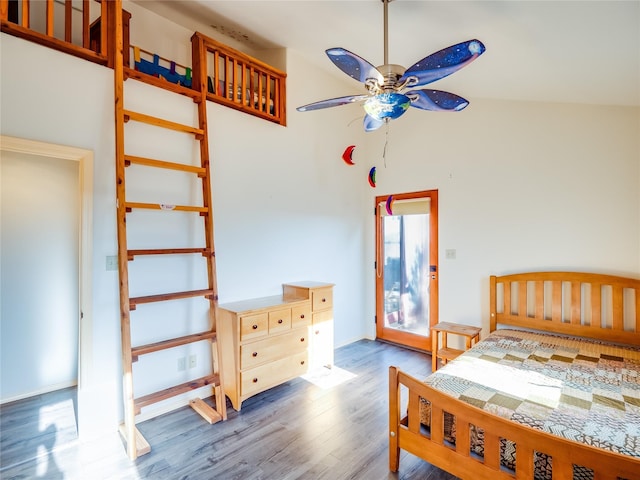 bedroom with high vaulted ceiling, dark wood-type flooring, and ceiling fan