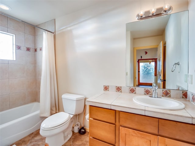 full bathroom featuring vanity, toilet, tile patterned flooring, and shower / tub combo