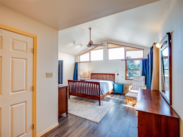 bedroom featuring vaulted ceiling, dark hardwood / wood-style floors, and ceiling fan