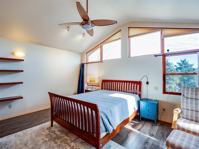 bedroom featuring hardwood / wood-style floors, vaulted ceiling, and ceiling fan