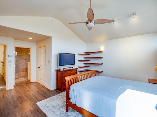 bedroom featuring ceiling fan, lofted ceiling, and hardwood / wood-style floors