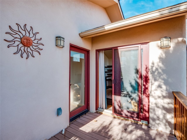 property entrance with a deck