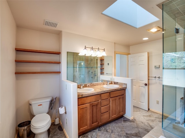 bathroom with vanity, toilet, an enclosed shower, and a skylight