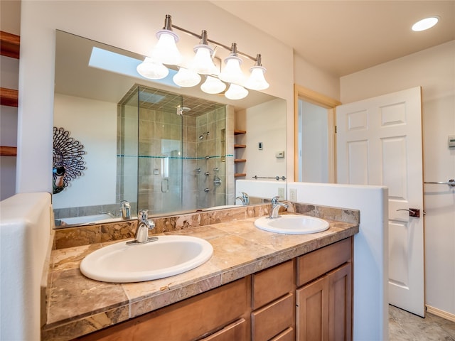 bathroom featuring vanity, tile patterned flooring, and a shower with door