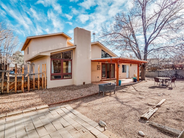 back of house featuring a patio