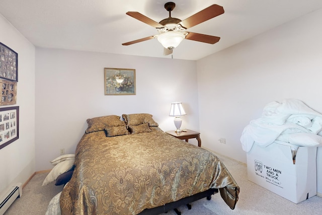 bedroom with ceiling fan, a baseboard radiator, and carpet flooring