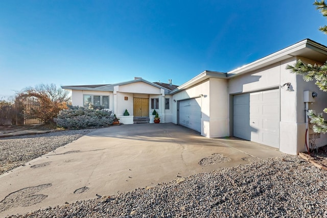 ranch-style home featuring a garage