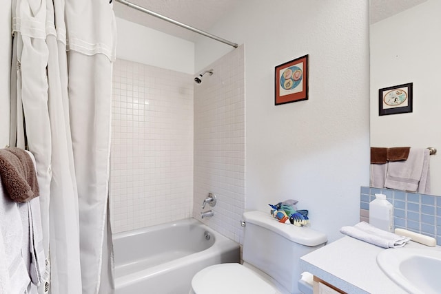 full bathroom featuring shower / tub combo with curtain, vanity, and toilet