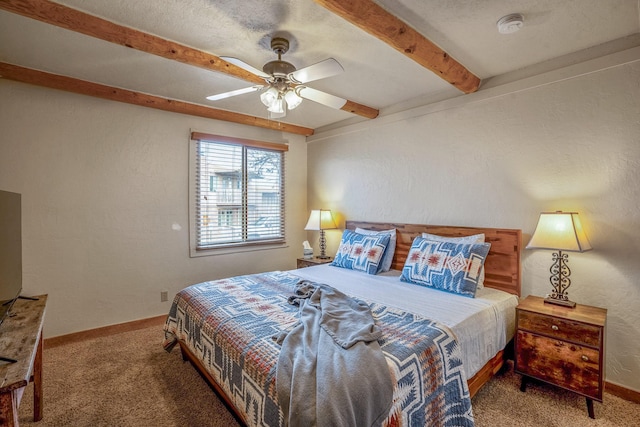 bedroom with beamed ceiling, ceiling fan, and carpet