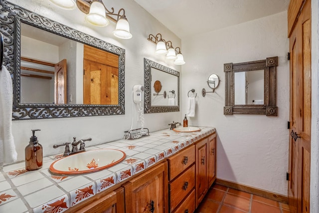 bathroom featuring tile patterned floors and vanity