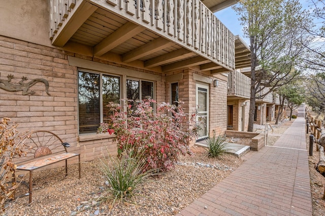 entrance to property featuring a balcony