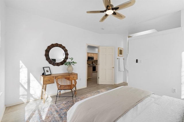 bedroom with light hardwood / wood-style floors and ceiling fan