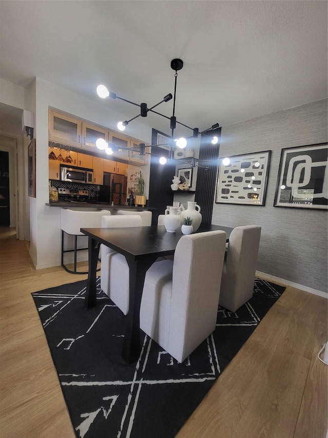 dining area with light hardwood / wood-style floors