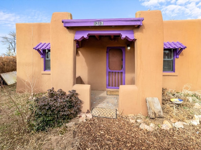 exterior space with stucco siding