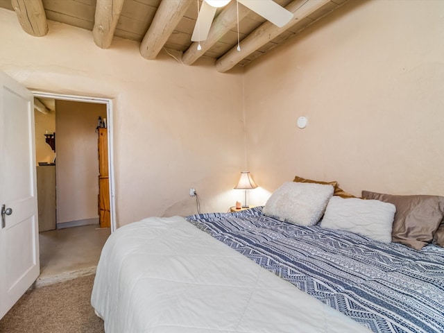 bedroom with beam ceiling, wood ceiling, and ceiling fan