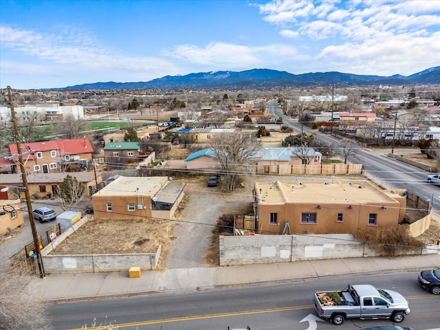 birds eye view of property with a mountain view