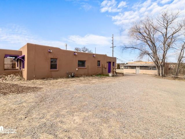 back of property with stucco siding