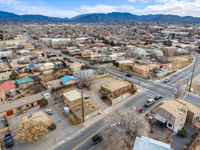 birds eye view of property featuring a mountain view