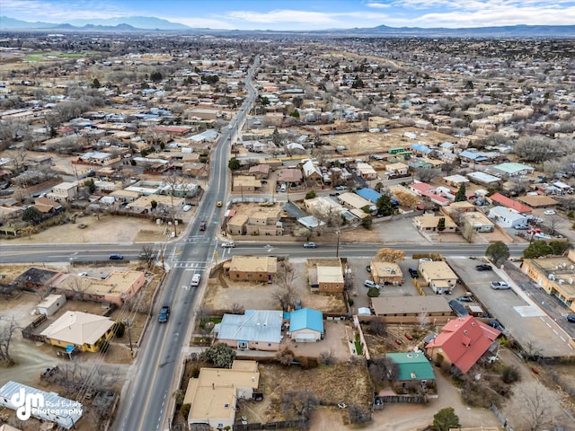 birds eye view of property featuring a mountain view